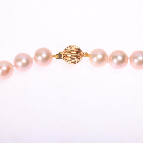 1177 - A single-strand natural pink freshwater cultured pearl necklace, set with individually knotted 9.5-1... 