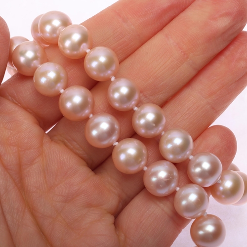 1177 - A single-strand natural pink freshwater cultured pearl necklace, set with individually knotted 9.5-1... 