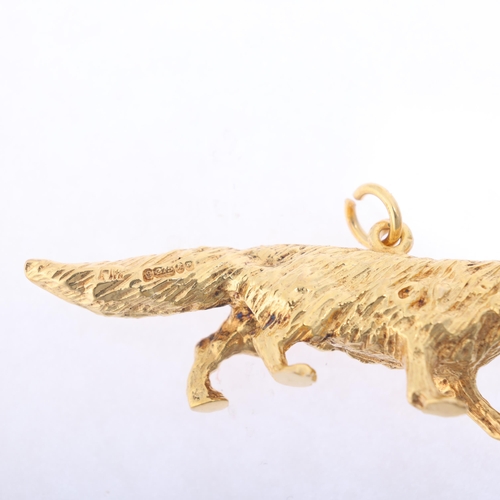 1184 - A 9ct gold fox charm/pendant, maker FM, London 1965, realistically modelled as a prowling fox, 41.8m... 