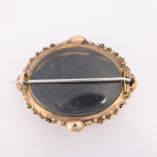 1203 - An Antique Victorian Etruscan Revival 9ct rose gold turquoise bombe mourning brooch, circa 1880, ova... 