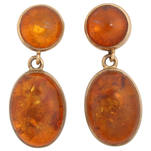 1205 - A pair of 9ct gold amber drop stud earrings, maker EWV, London 1997, set with round and oval cabocho... 