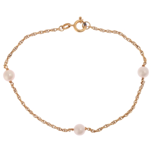 1210 - A 9ct gold pearl spacer link chain bracelet, import London 1984, 17cm, 1.7g