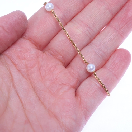 1210 - A 9ct gold pearl spacer link chain bracelet, import London 1984, 17cm, 1.7g