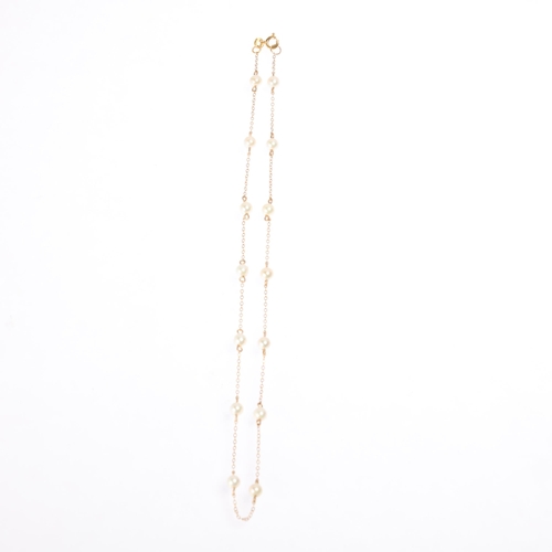 1211 - A 9ct gold pearl spacer link chain necklace, import London 1984, 38cm, 3.7g