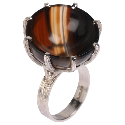 1213 - A Vintage 9ct white gold banded agate cup ring, maker CW, London 1979, set with round polished conca... 