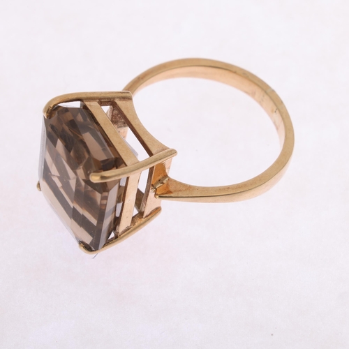 1215 - A 9ct gold smoky quartz dress ring, indistinct maker, Birmingham 1998, claw set with octagonal step-... 