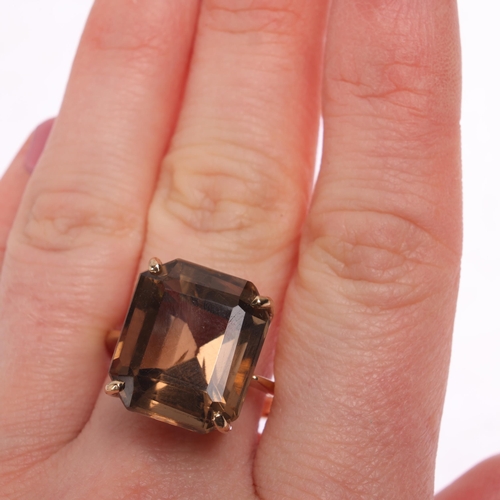 1215 - A 9ct gold smoky quartz dress ring, indistinct maker, Birmingham 1998, claw set with octagonal step-... 