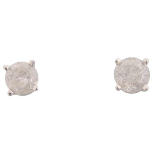 1218 - A pair of 14ct white gold 0.4ct single stone diamond stud earrings, each claw set with 0.2ct modern ... 