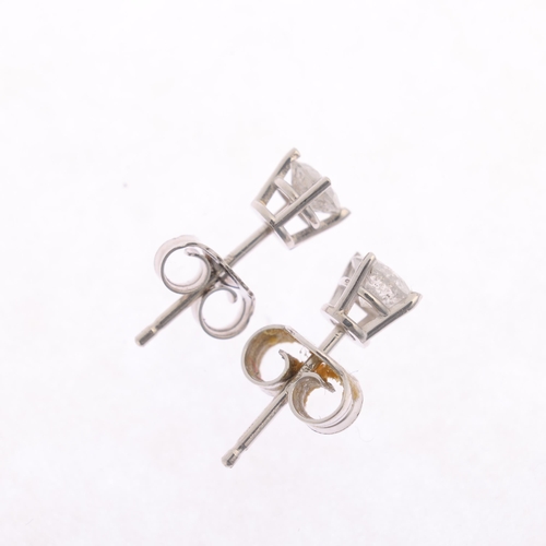 1218 - A pair of 14ct white gold 0.4ct single stone diamond stud earrings, each claw set with 0.2ct modern ... 