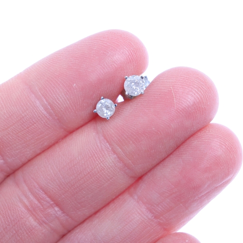 1218 - A pair of 14ct white gold 0.4ct single stone diamond stud earrings, each claw set with 0.2ct modern ... 