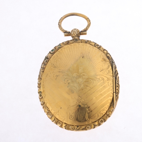 1219 - A large Antique Victorian gold plated locket pendant, oval form with allover engraved floral decorat... 