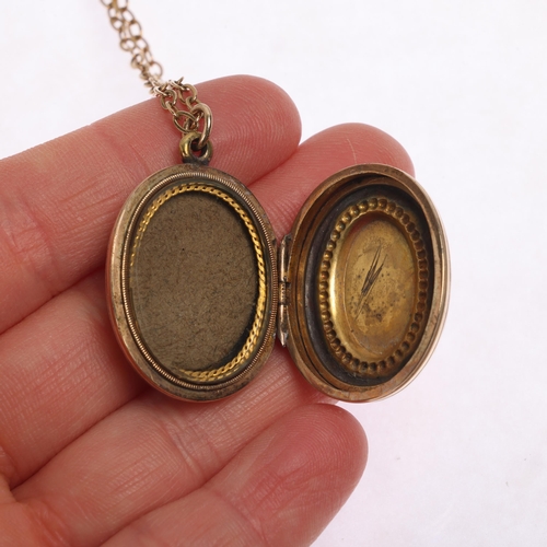 1224 - An Antique Victorian pink paste and split pearl locket pendant necklace, on 9ct gold belcher link ch... 