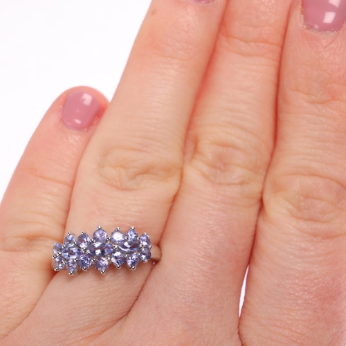 1242 - A 9ct white gold tanzanite cluster ring, set with marquise and round-cut tanzanites, setting height ... 