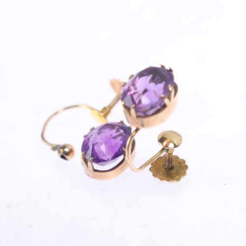 1246 - A pair of 9ct gold amethyst earrings, claw set with oval mixed-cut amethysts, and screw-back fitting... 