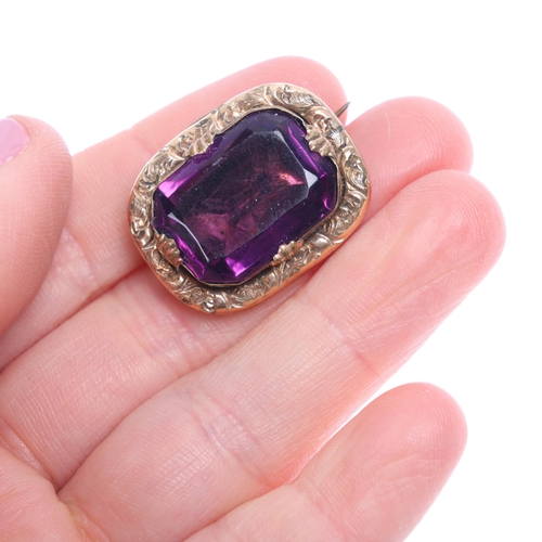 1247 - An Antique Georgian purple paste mourning brooch, circa 1820, oval form with collet set foil-back pu... 