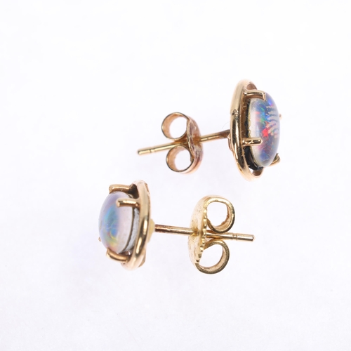 1256 - A pair of 14ct gold black opal triplet stud earrings, unmarked mount tests as 14ct, 9.6mm, 1.6g