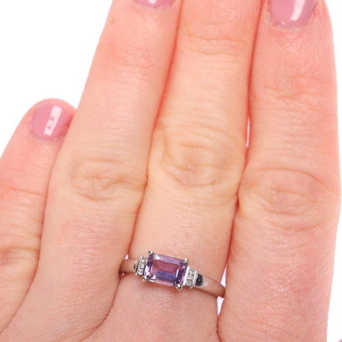 1257 - A 9ct white gold amethyst and diamond dress ring, setting height 5.8mm, size M, 1.7g