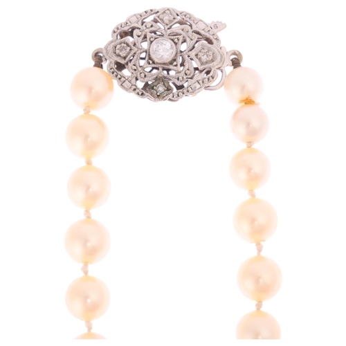 1273 - A Vintage single-strand pearl bead necklace, set with 7mm pearls, with 9ct white gold diamond openwo... 