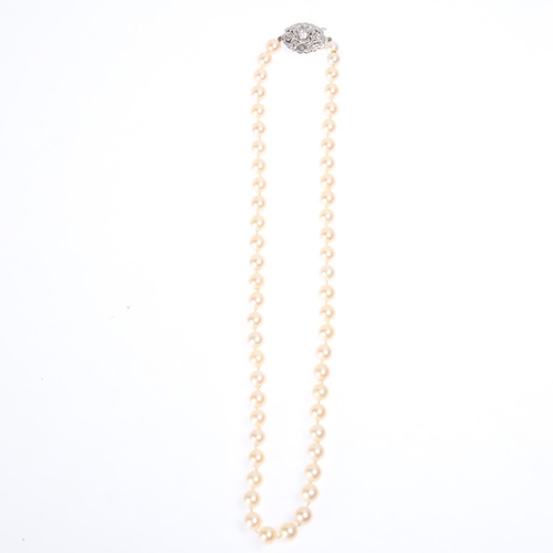 1273 - A Vintage single-strand pearl bead necklace, set with 7mm pearls, with 9ct white gold diamond openwo... 