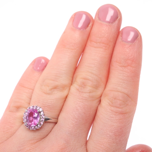 1276 - A 9ct white gold pink sapphire cluster ring, set with oval and round-cut pink sapphires, setting hei... 