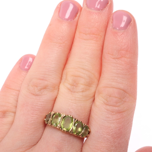 1277 - A 9ct gold five stone peridot half hoop ring, set with oval mixed-cut peridots, setting height 7.9mm... 