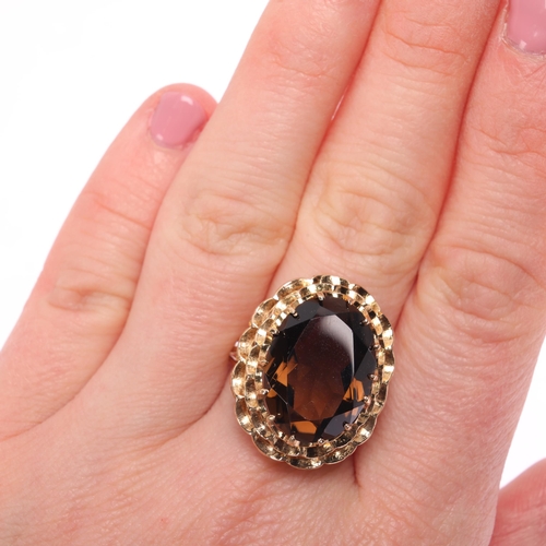 1286 - A Vintage 9ct gold smoky quartz dress ring, maker FM, London 1973, set with oval mixed-cut smoky qua... 