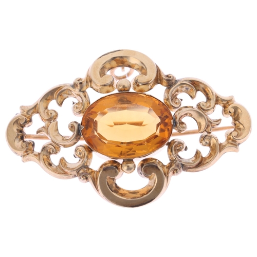 1289 - An Antique Victorian 9ct gold citrine brooch, rub over set with oval mixed-cut citrine within openwo... 