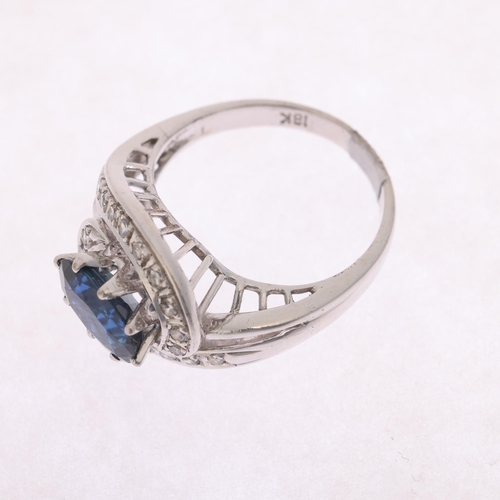 1293 - An 18ct white gold sapphire and diamond tourbillon cluster ring, set with oval mixed-cut sapphire an... 