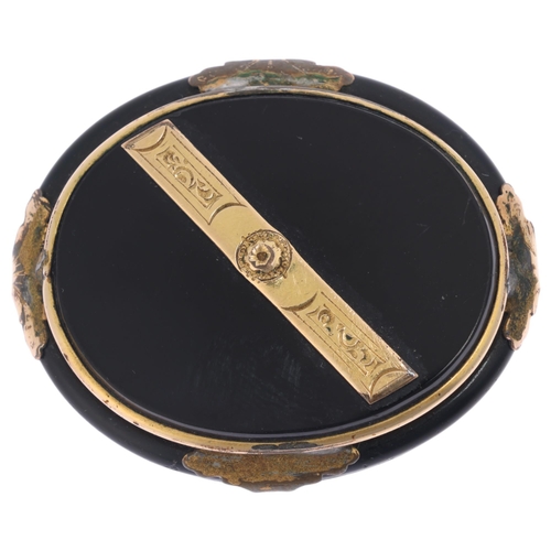 1294 - An Antique Victorian onyx mourning brooch, with applied gilt-metal mounts, 43.3mm, 12.6g