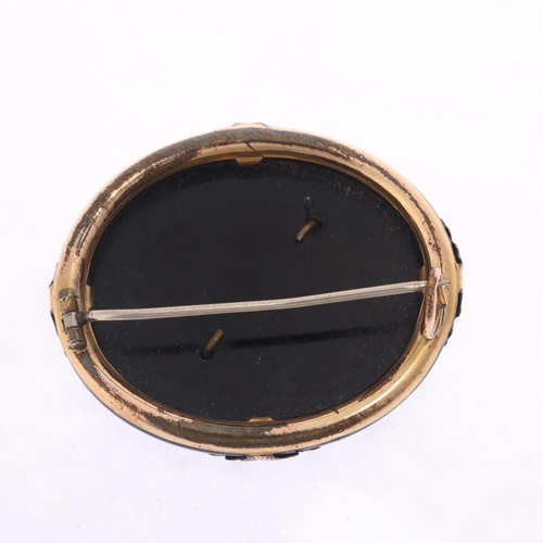 1294 - An Antique Victorian onyx mourning brooch, with applied gilt-metal mounts, 43.3mm, 12.6g