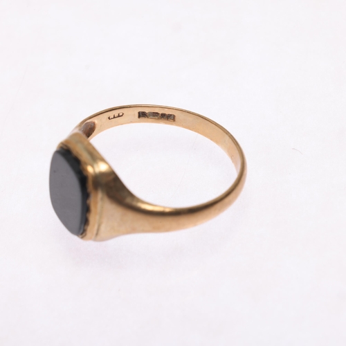 1303 - A 9ct gold onyx signet ring, maker HVS, setting height 11.1mm, size K, 1.8g