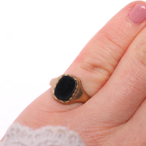 1303 - A 9ct gold onyx signet ring, maker HVS, setting height 11.1mm, size K, 1.8g