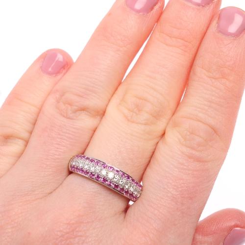 1320 - An 18ct white gold pink sapphire and diamond band ring, maker PJW, London 2002, set with central row... 