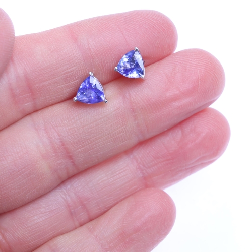 1322 - A pair of 18ct white gold single stone tanzanite stud earrings, claw set with trillion-cut tanzanite... 