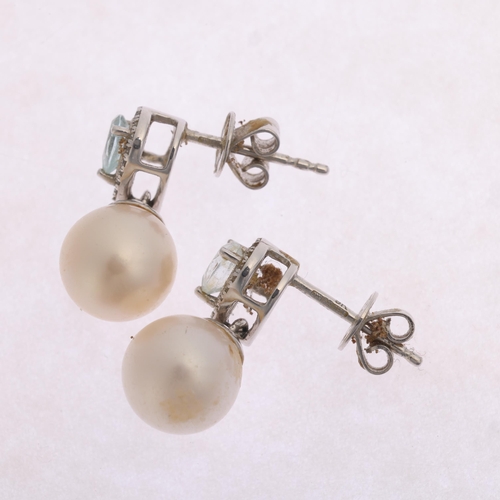 1325 - A pair of 9ct white gold pearl aquamarine and diamond drop stud earrings, set with 7.8mm pearls susp... 