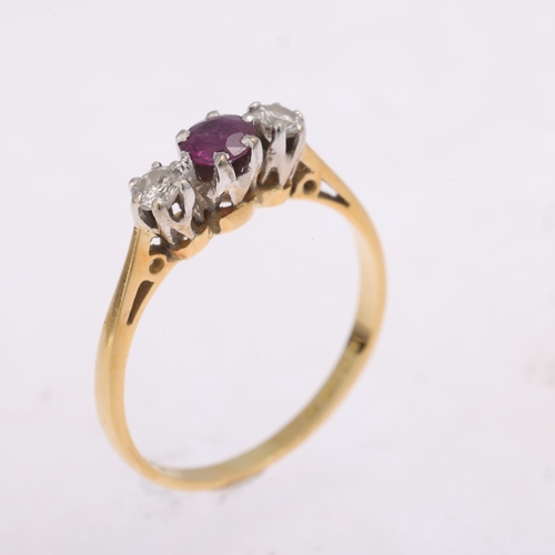 1326 - An 18ct gold three stone ruby and diamond ring, maker TL, London 1977, claw set with round-cut ruby ... 