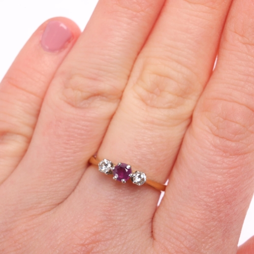 1326 - An 18ct gold three stone ruby and diamond ring, maker TL, London 1977, claw set with round-cut ruby ... 