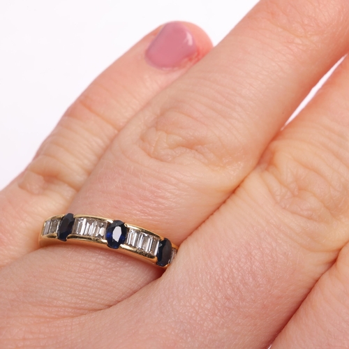 1329 - An 18ct gold sapphire and diamond half eternity ring, channel set with oval mixed-cut sapphires and ... 