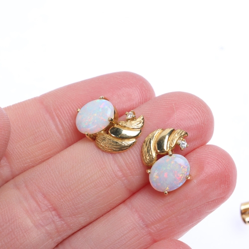 1335 - A pair of 18ct gold opal and diamond stud earrings, claw set with oval cabochon opals and modern rou... 