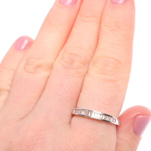 1336 - A 14ct white gold diamond half eternity ring, channel set with baguette-cut diamonds, total diamond ... 