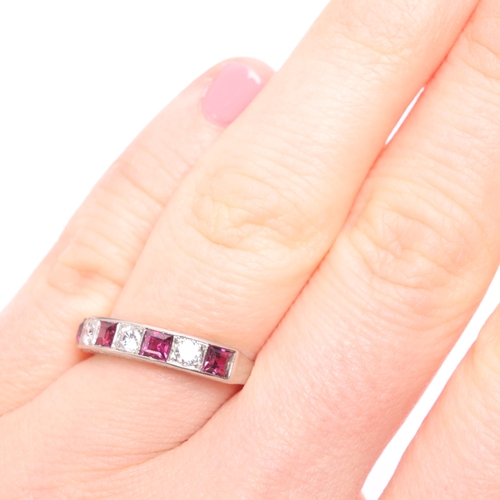 1340 - CROPP & FARR - an Art Deco platinum seven stone ruby and diamond half eternity ring, set with square... 