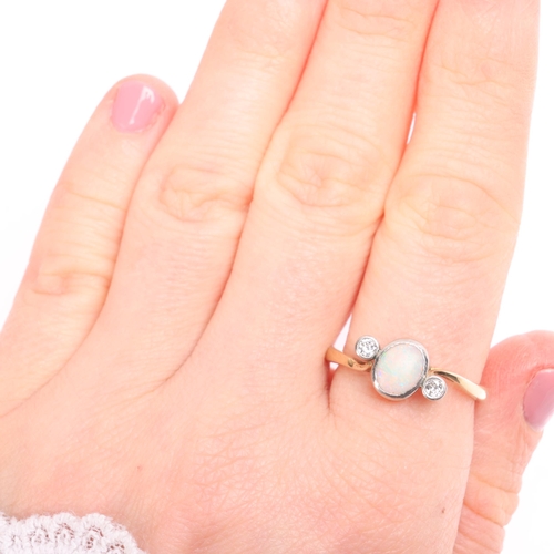 1341 - An 18ct gold three stone opal and diamond crossover ring, rub over set with oval cabochon opal and o... 