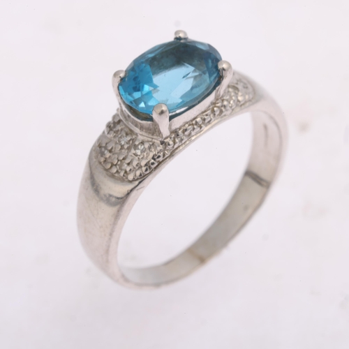 1387 - A 9ct white gold blue topaz and diamond dress ring, claw-set with oval mixed cut topax and diamond s... 