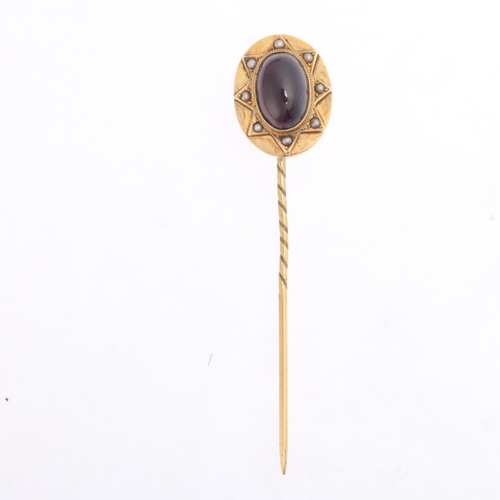 1394 - An Antique Victorian Etruscan revival 18ct gold carbuncle garnet and split pearl stickpin, the oval ... 