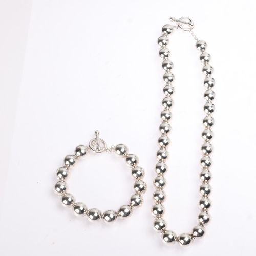 1406 - A sterling silver ball chain necklace and bracelet set, 47cm and 22cm, 103.3g total (2)