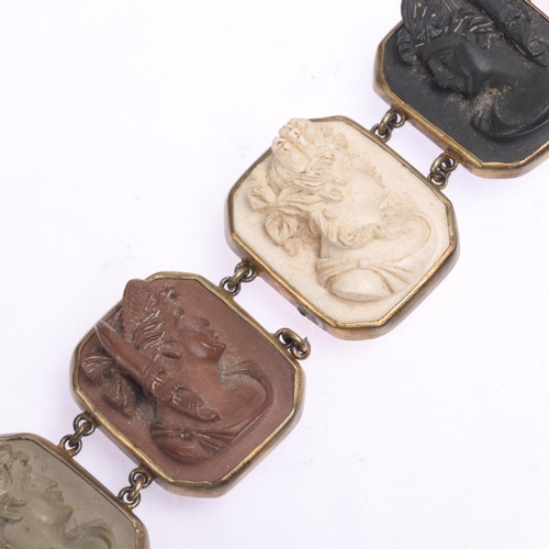 1410 - An Antique Victorian Gran Tour brass lava cameo panel bracelet, relief carved panels depicting Class... 