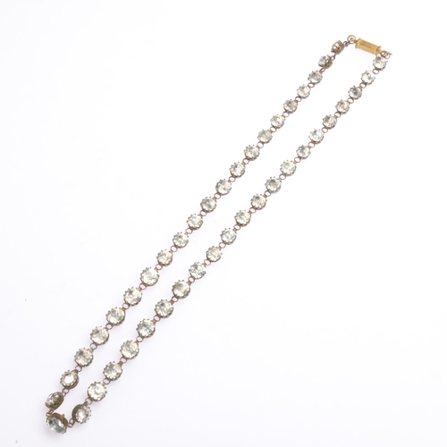 1414 - An Antique gilt-metal paste Riviere necklace, 48cm