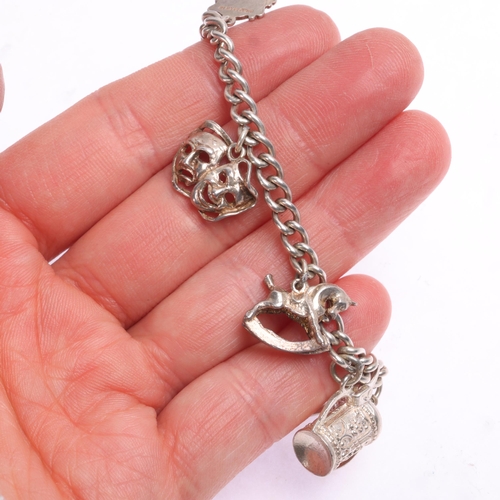 1423 - A sterling silver curb link charm bracelet, 18cm, 27.3g