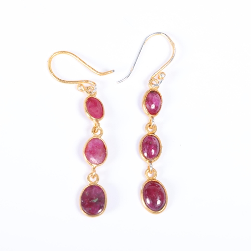 1435 - A pair of sterling silver-gilt ruby drop earrings, set with round cabochon rubies, with shepherd hoo... 