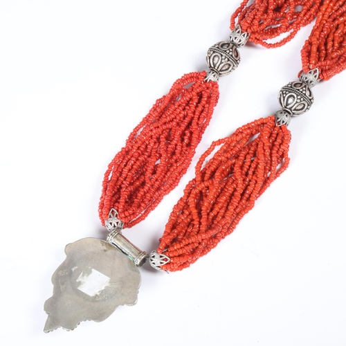 1491 - A Tibetan multi-strand coral bead necklace, with white metal coral pendant, pendant 59.5mm, necklace... 